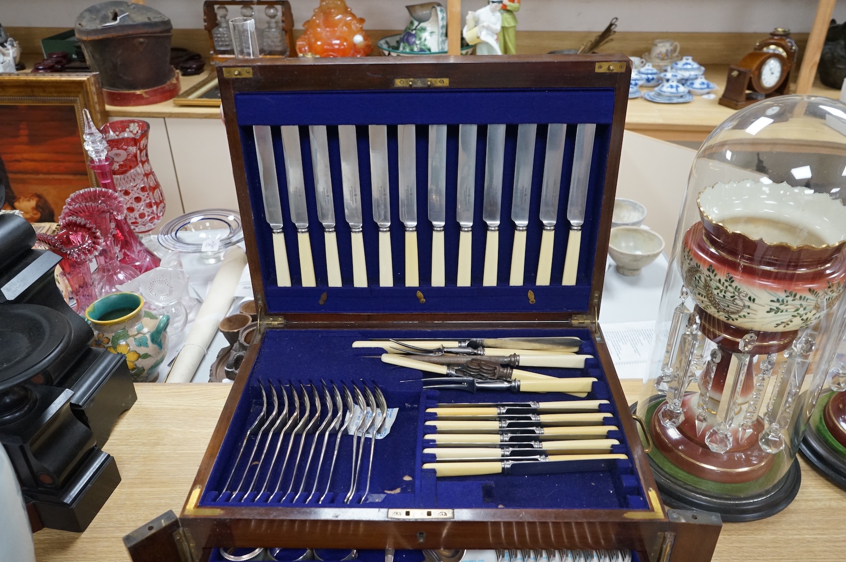 A Walker & Hall three-drawer canteen of plated cutlery. Canteen 48cm wide x 35cm deep x 24cm high. Condition - good